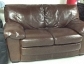 Jennifer convertible brown leather love seat