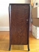 Small antique wooden cabinet with record slots